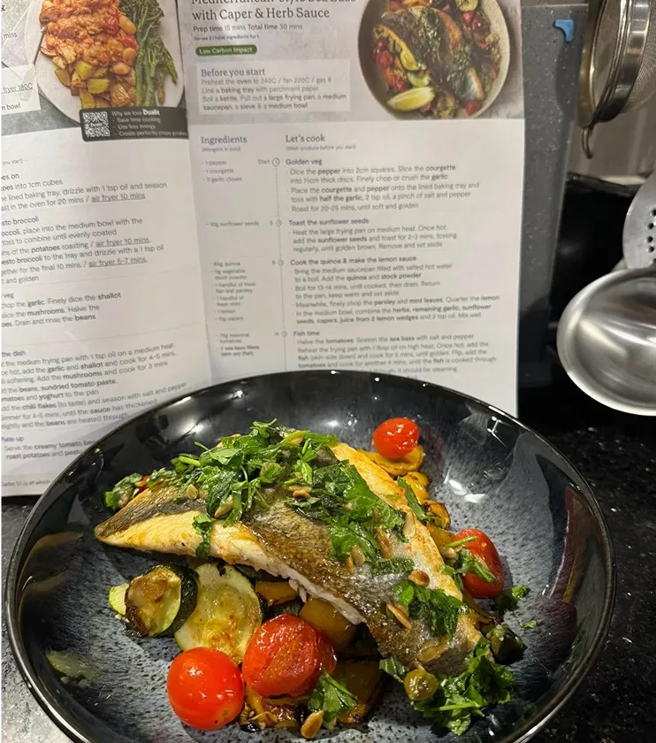 A vibrant Sea Bass recipe featuring fresh seasonal greens and wholesome ingredients from a Mindful Chef recipe box.