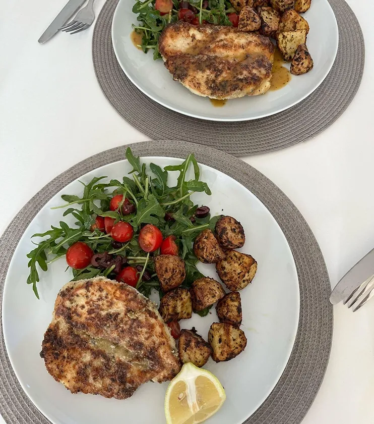A high protein recipe featuring salad, chicken and potatoes.
