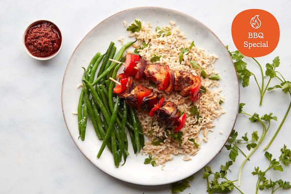 Smokey pork kebabs, green beans, and herby rice